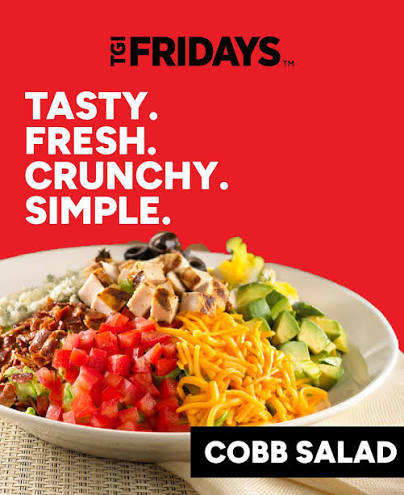 TGI Friday's marketing photo for its Million Dollar Cobb Salad, plated with grilled chicken, bacon, tomato, shredded cheese, and avocado, under the tagline 'Tasty. Fresh. Crunchy. Simple.'